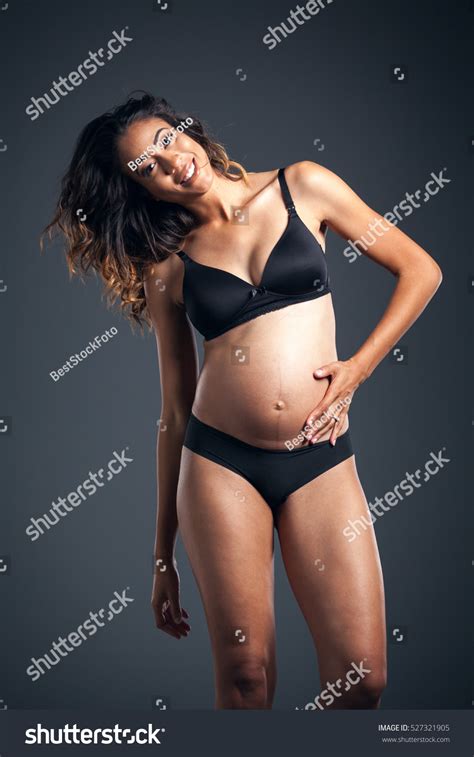 Beautiful Pregnant African American Woman Wearing Stock