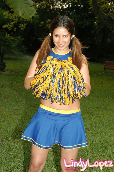 hot cheerleader in a short skirt with a sparkling belly