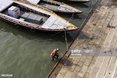 hindu pilgrims bathing in river ganges varanasi india photos and
