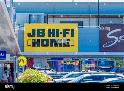 brand  jb  fi home  black   yellow background   exterior   store