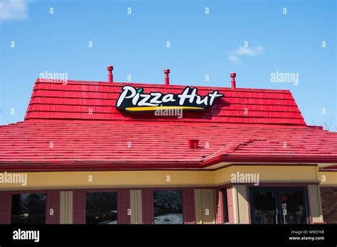 pizza hut restaurant building  gloversville ny usa   clear blue sky background stock