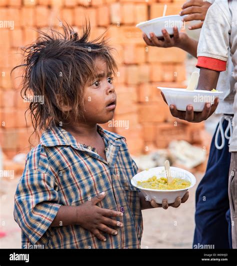 poor children   food distribution camp   delhi india stock