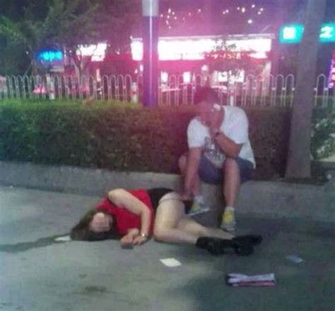 extremely intoxicated woman passed out on the street gets taken advantage of by stranger