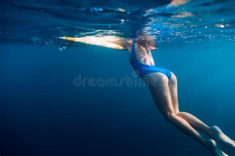 Underwater Woman In Blue Bikini With Surfboard Relaxing In Ocean Stock