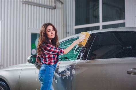 Premium Photo Girl Washing A Car