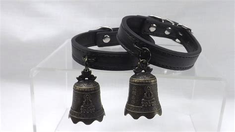 bdsm black leather wrist cuffs with large bells bdsm wrist