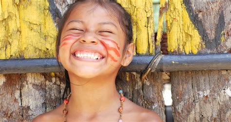cute native brazilians having fun at an indigenous tribe