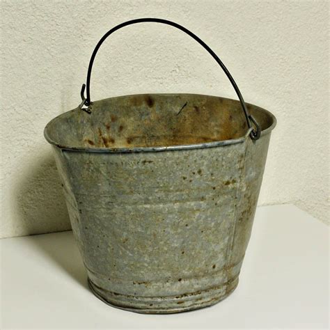 vintage metal bucket pail milk bucket galvanized holes in the bottom for water to drain