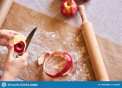 womans hands peeling  apple baking ingredients   table ready  cooking concept