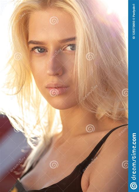 tender blonde blue eyed model with natural makeup and hair