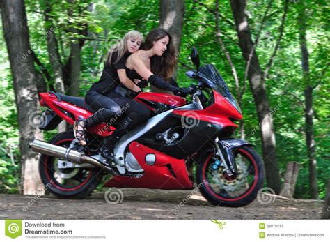two girls on a sport bike stock image image of passion