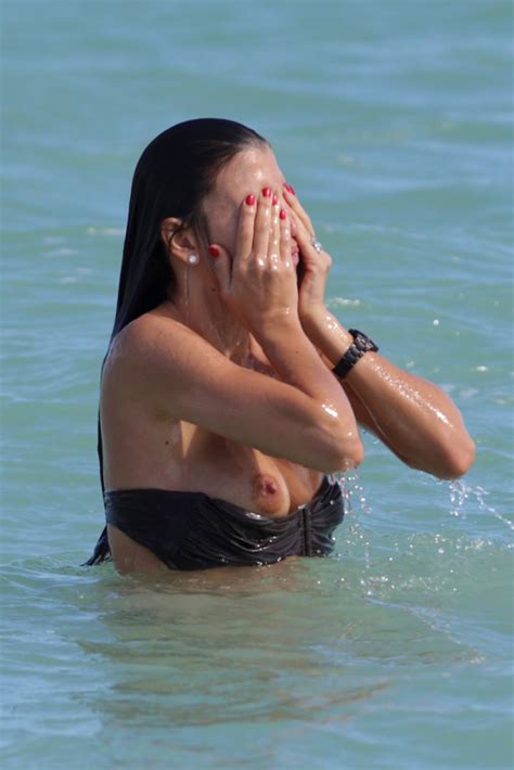 claudia galanti bikini double boob slip and nipple slip again and again in miami sexmenu