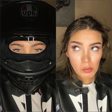 A Woman Wearing A Motorcycle Helmet And Looking At The Camera With Her