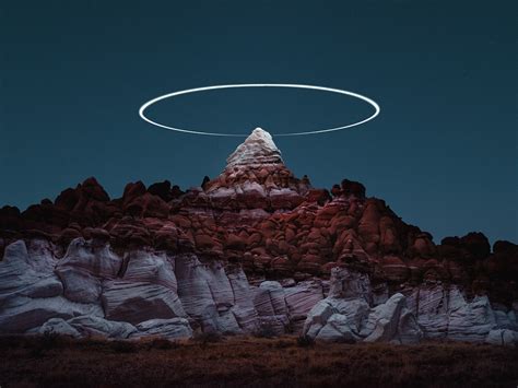 long exposure drone photographs create light halos  mountains