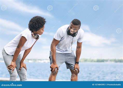 afro couple catching breath  morning jog  river stock image image  pause outdoor