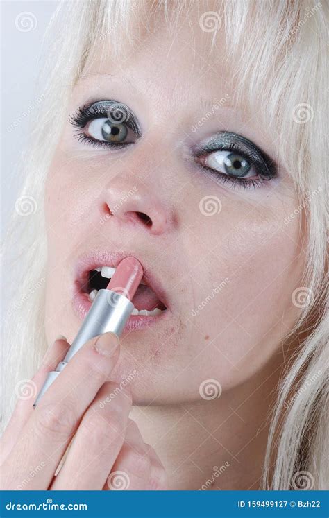 Young Woman Applying Pink Lipstick Stock Image Image Of Blond Woman