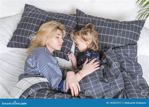 Daughter And Mother Are Sleeping In Bed Stock Image Image Of Care