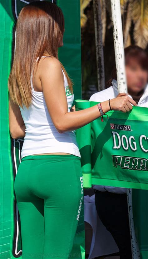 9 creep shots of two models in green yoga pants promoting