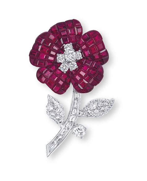 a mystery set ruby and diamond pavot brooch by van cleef and arpels