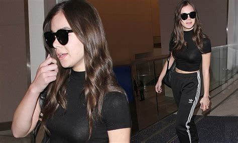 hailee steinfeld teases glimpse at her toned tummy as she lands at lax