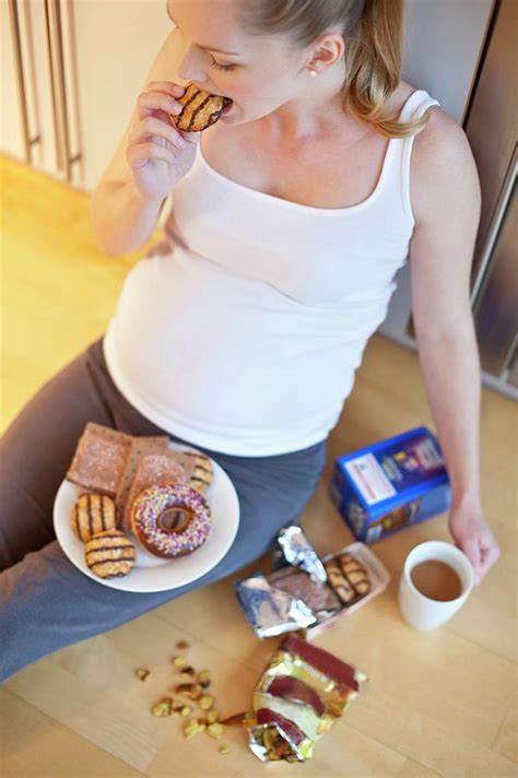 Pregnant Woman Eating Biscuit Photograph By Ian Hooton Science Photo