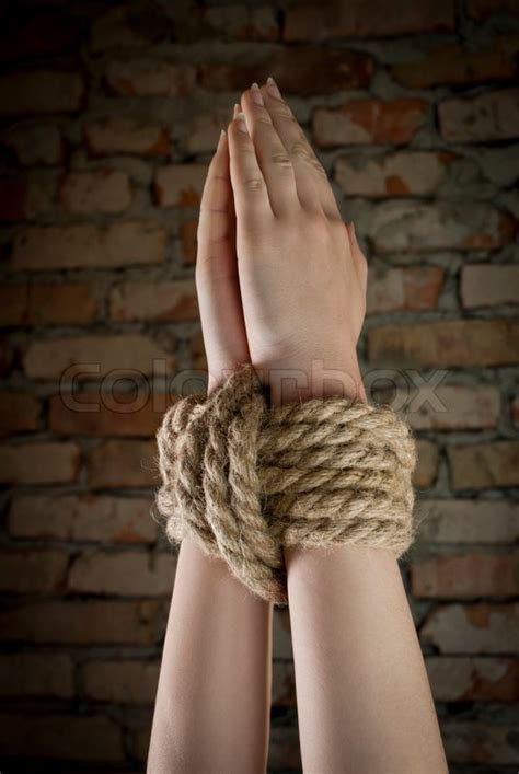 hands tied up with rope stock image colourbox