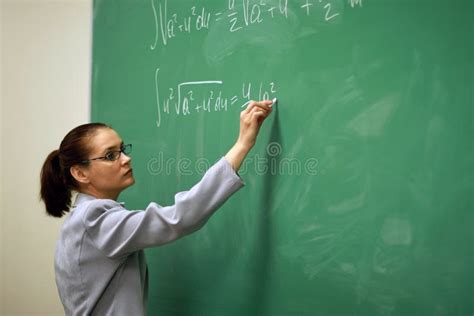 young teacher writing   board stock image image  professor