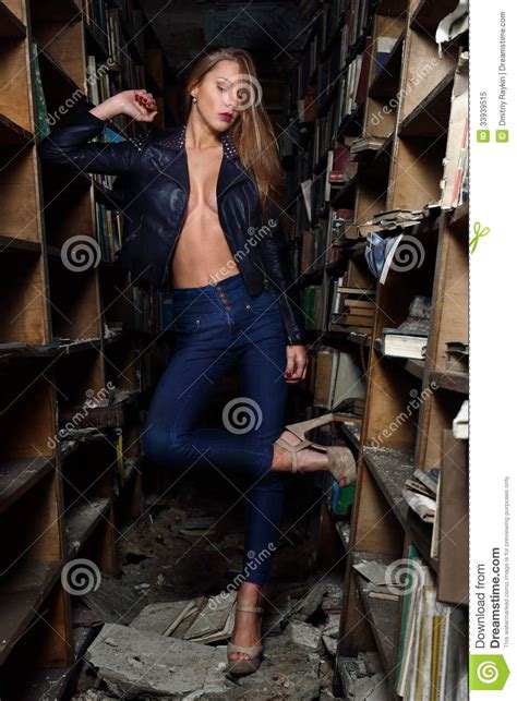 Woman Is Posing In The Old Library Royalty Free Stock