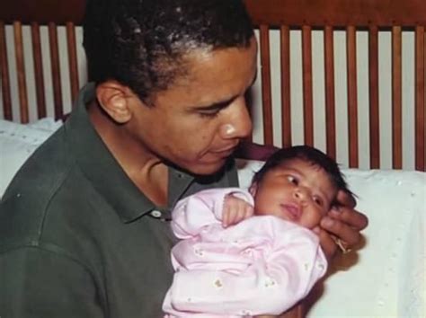 barack obama holding his newborn first born malia a touching moment in time aww moments