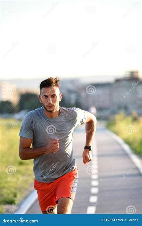 ssports man running fast outdoors   race track stock image image