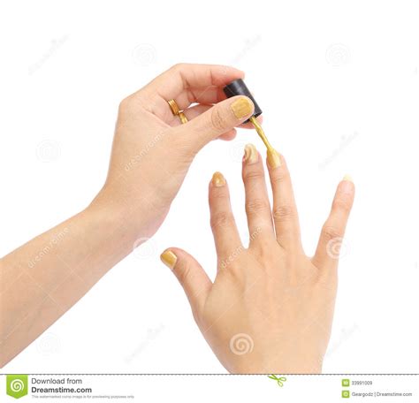 female hand with a golden nail polish on white background royalty free stock images image