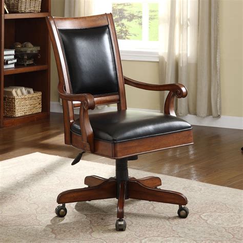 caster equipped wooden desk chair  leather covered seat