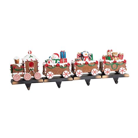 home accents gingerbread train stocking hangers 4 piece