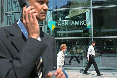 abn amro slashes   senior management  bank shrinks mint