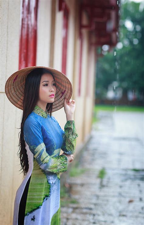 vietnamese women wear ao in the rain ao dai is famous traditional
