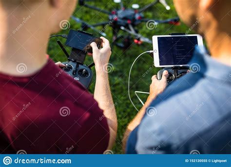 handsome young man flying  drone outdoors stock image image  hood hipster