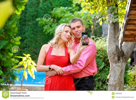 Couple Fun Taking Self Portrait Picture Photos With Mobile Smart Stock