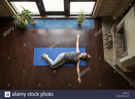 yoga  home belly twist pose stock photo alamy