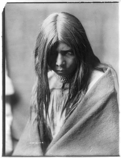 Zosh Clishn Apache Looking Down Wrapped In A Blanket And Wearing
