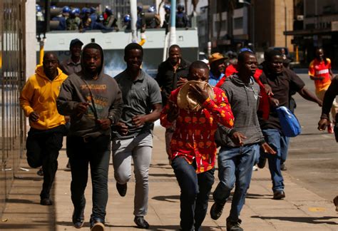 police and protesters clash in zimbabwe s capital pbs newshour