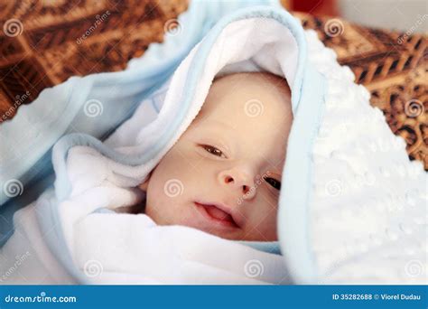 baby portrait covered  blanket stock photo image  smile baby