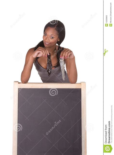 african american woman with condoms by blackboard stock