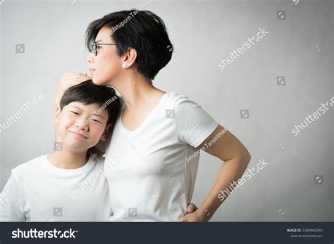 smart beautiful asian mom holding her stockfoto 1399960340 shutterstock