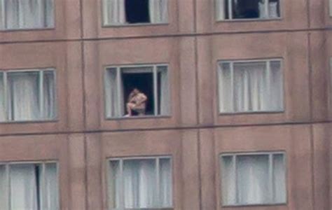 blown up picture of shanghai panorama reveals naked man in hotel window