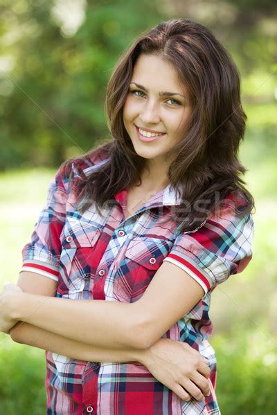 Beautiful Teen Girl In The Park At Green Grass Stock