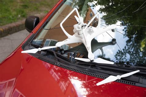 damaged white drone  broken car windshield bwi aviation  drone insurance