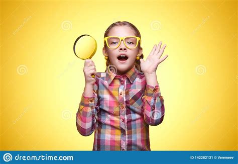 teen girl with magnifying glass very surprised stock image