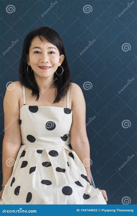 Portrait Of A Beautiful Adult Asian Woman 40 Year Old With Short Black