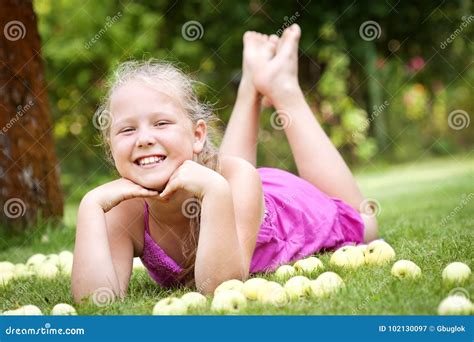 cute young girl   garden stock image image  happy pile