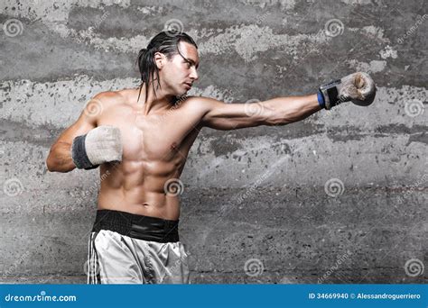 muscular boxer man punching stock photo image